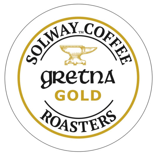 Logo of Solway Coffee Roasters Gretna Gold with a yellow anvil symbol on a white background.